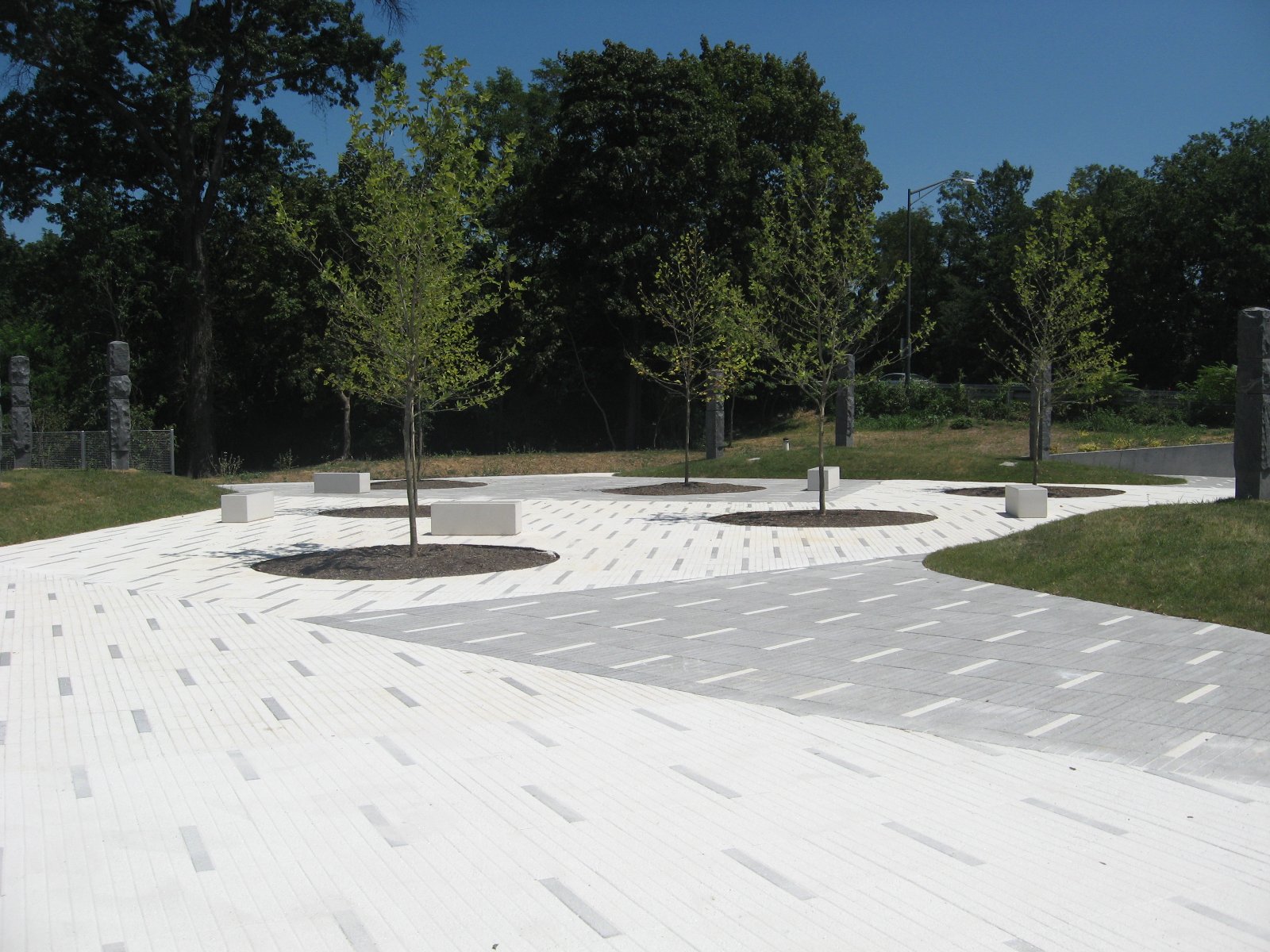 Legacy Memorial Park — white paving, tree circles and benches