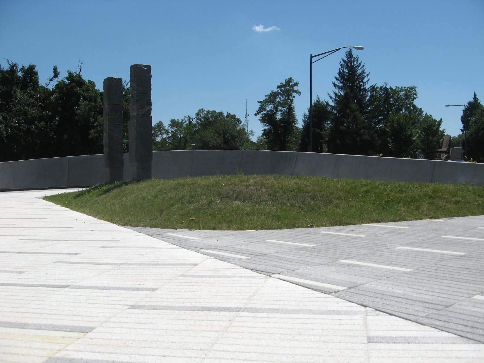 Legacy Memorial Park — two columns on the mound against the wall